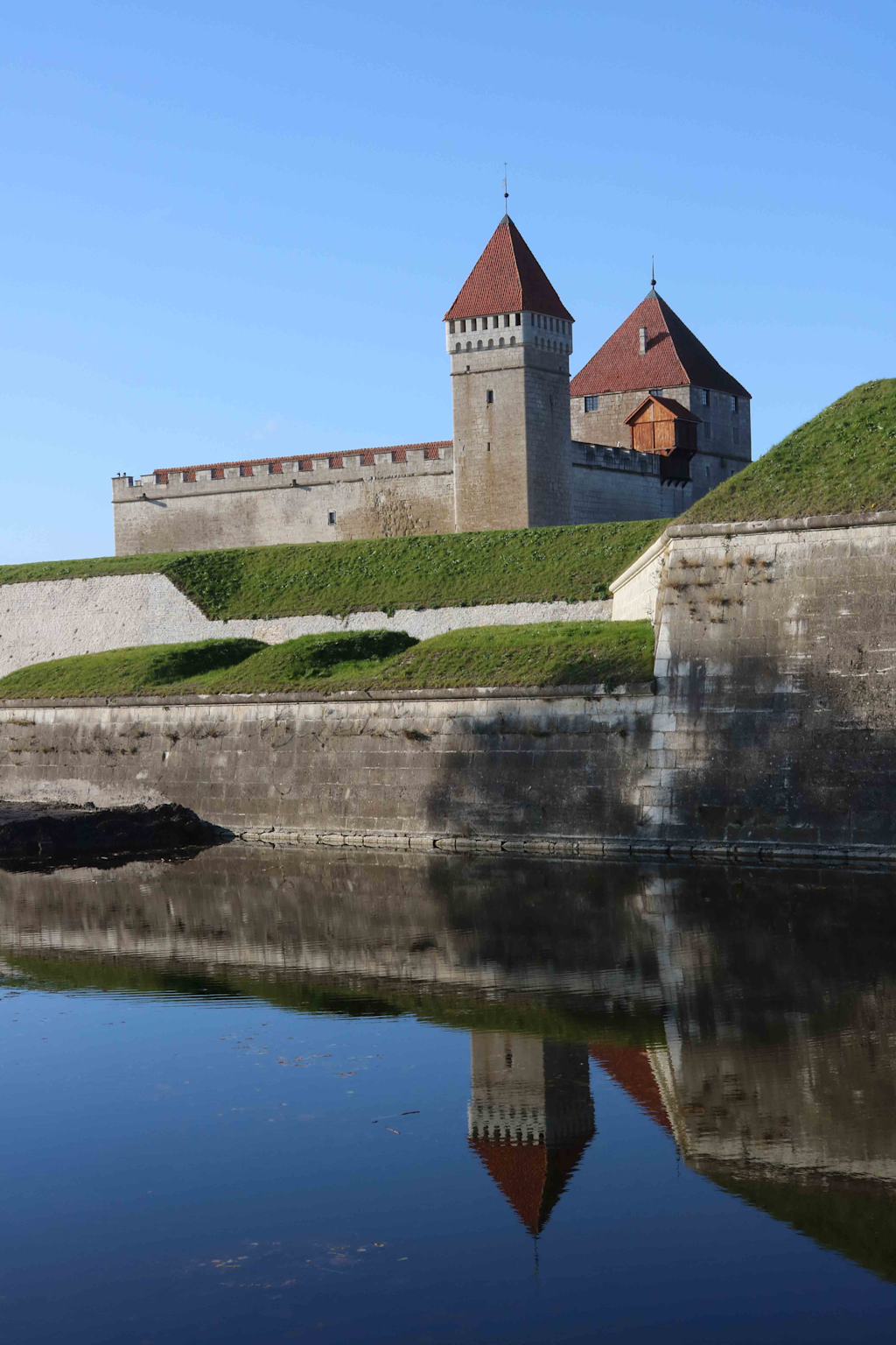 Kuressaare Castle on Saaremaa Island, Estonia, reflecting medieval history and tranquil natural surroundings