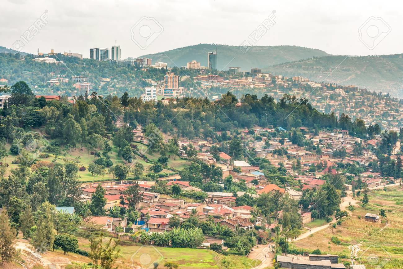 Panoramic view of Kigali city showing residential areas and modern buildings amidst hilly terrain in Rwanda.