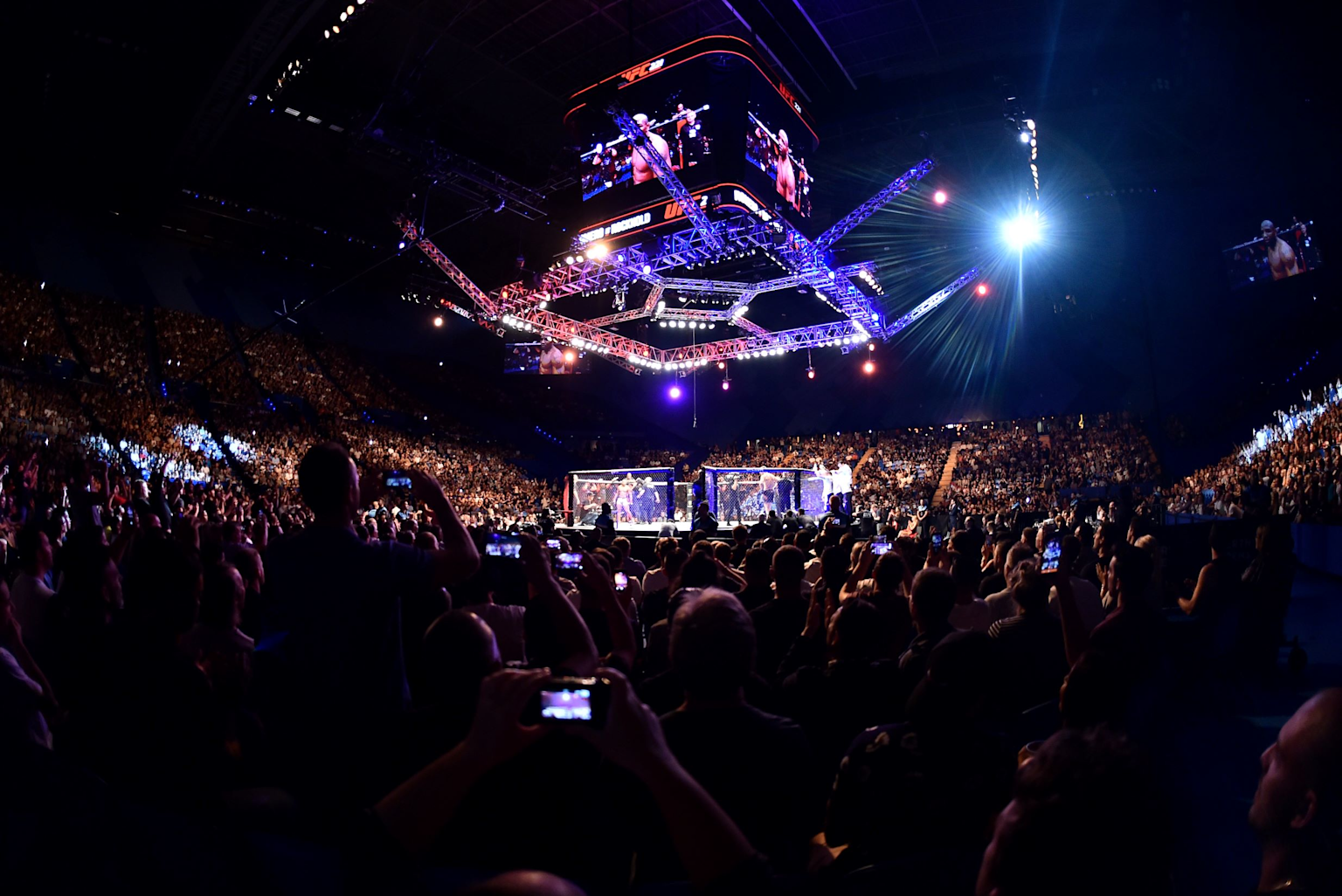 Sold-out UFC event at Perth's arena showcasing vibrant crowd and octagonal fight cage