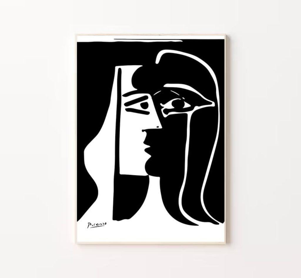 Artwork illustrating the use of positive and negative space to create dual face profiles in high contrast black and white