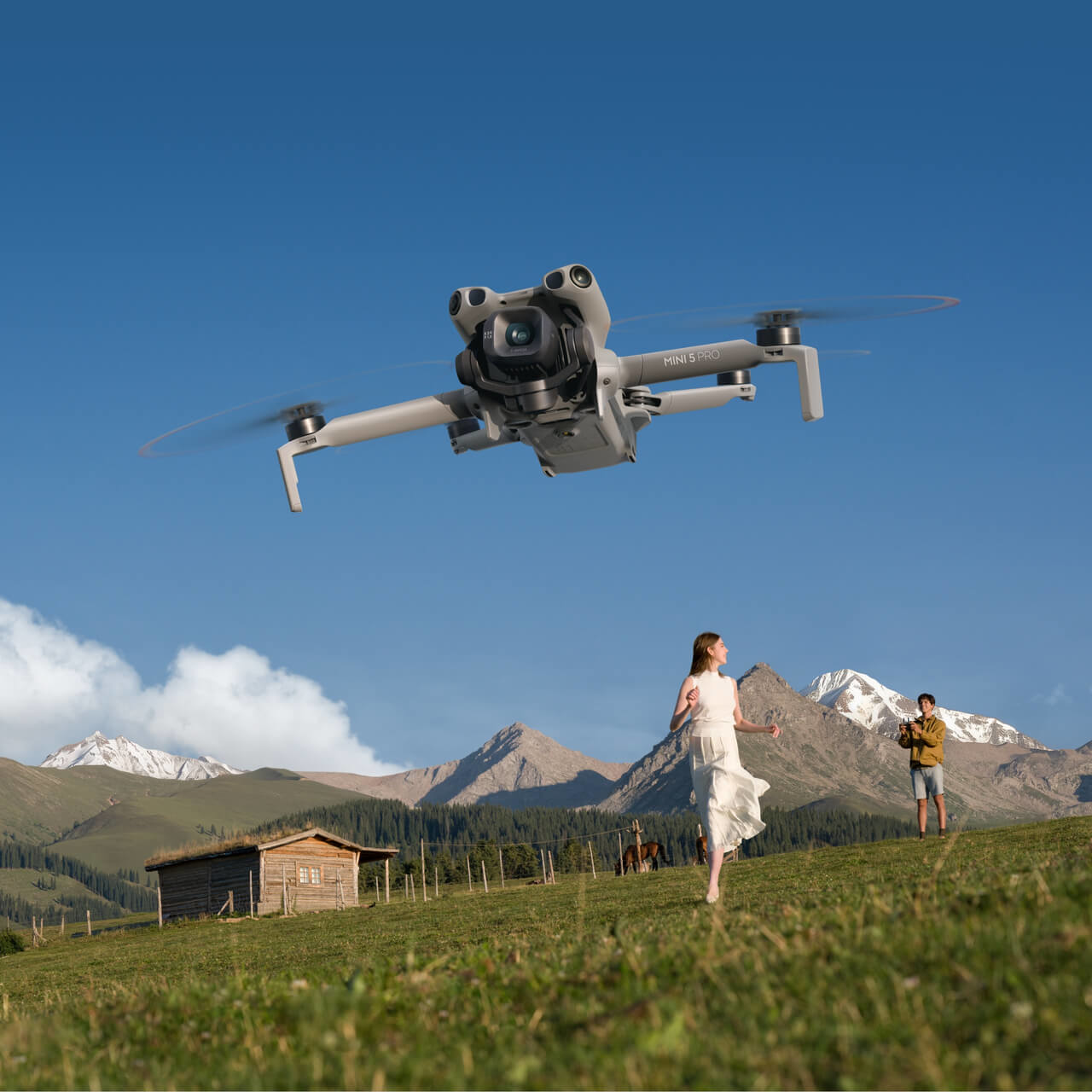 DJI Mini 5 Pro drone in flight demonstrating its advanced camera and gimbal capabilities in an outdoor mountainous setting