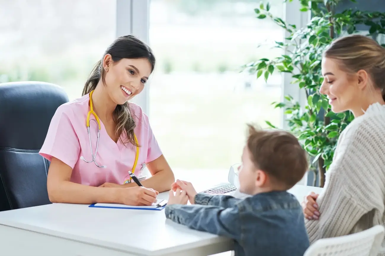 Medical consultation for autism diagnosis with a healthcare professional, child patient, and parent.