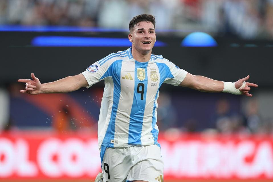 Julian Álvarez celebrating in the Argentine national team jersey, wearing number 9