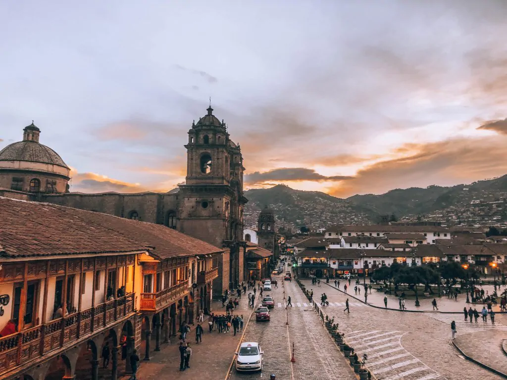 Sunset over the colonial Plaza de Armas in Cusco, Peru, highlighting historic architecture and the city's vibrant cultural atmosphere