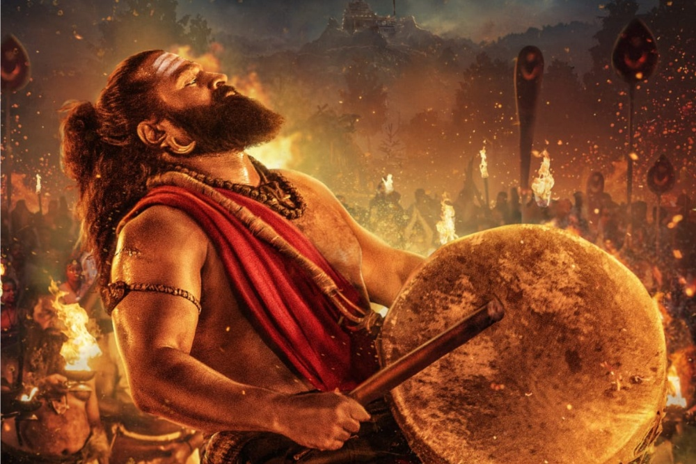 Scene from 'Kantara Chapter 1' showing Rishab Shetty's intense performance in a traditional ritual setting