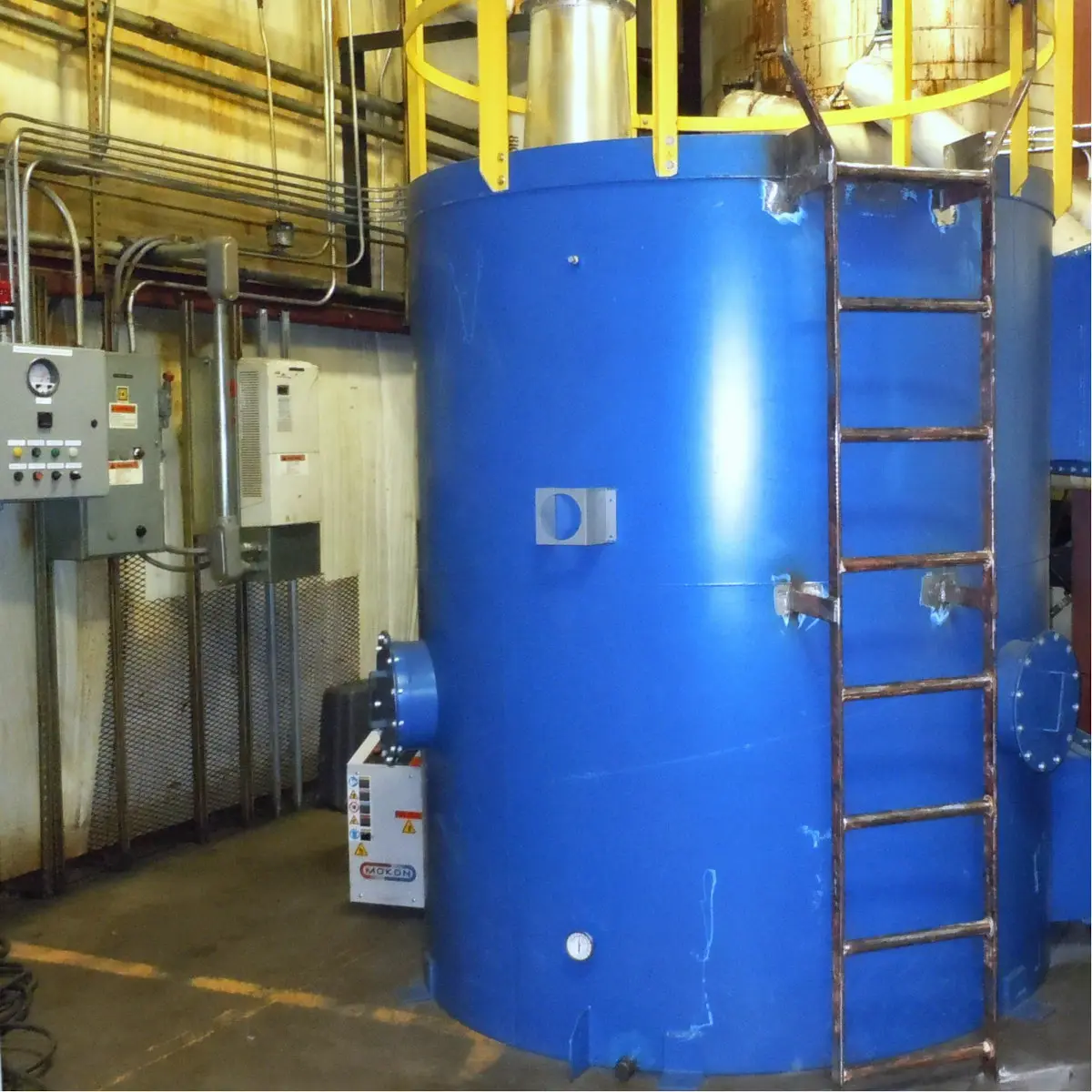 Large industrial VOC control system tank and associated equipment for managing emissions and odour control