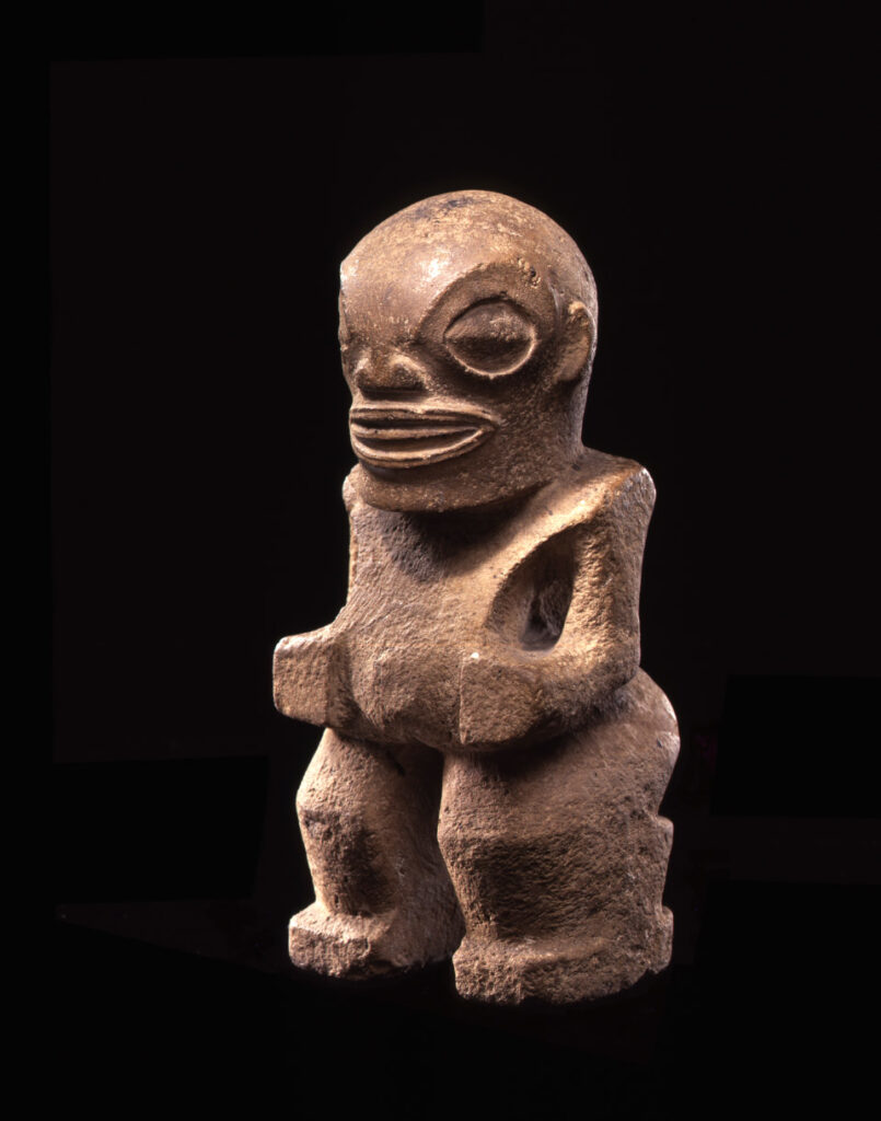 Traditional Marquesan tiki stone sculpture with stylized human features