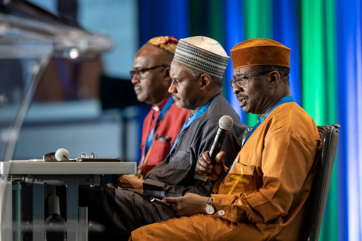Nigerian religious leaders from Christian and Muslim communities speaking at a conference, illustrating their political and social influence