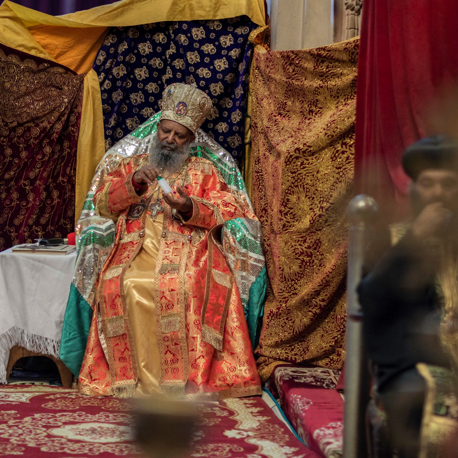 Ethiopian Orthodox Church leader dressed in ceremonial robes at a formal event