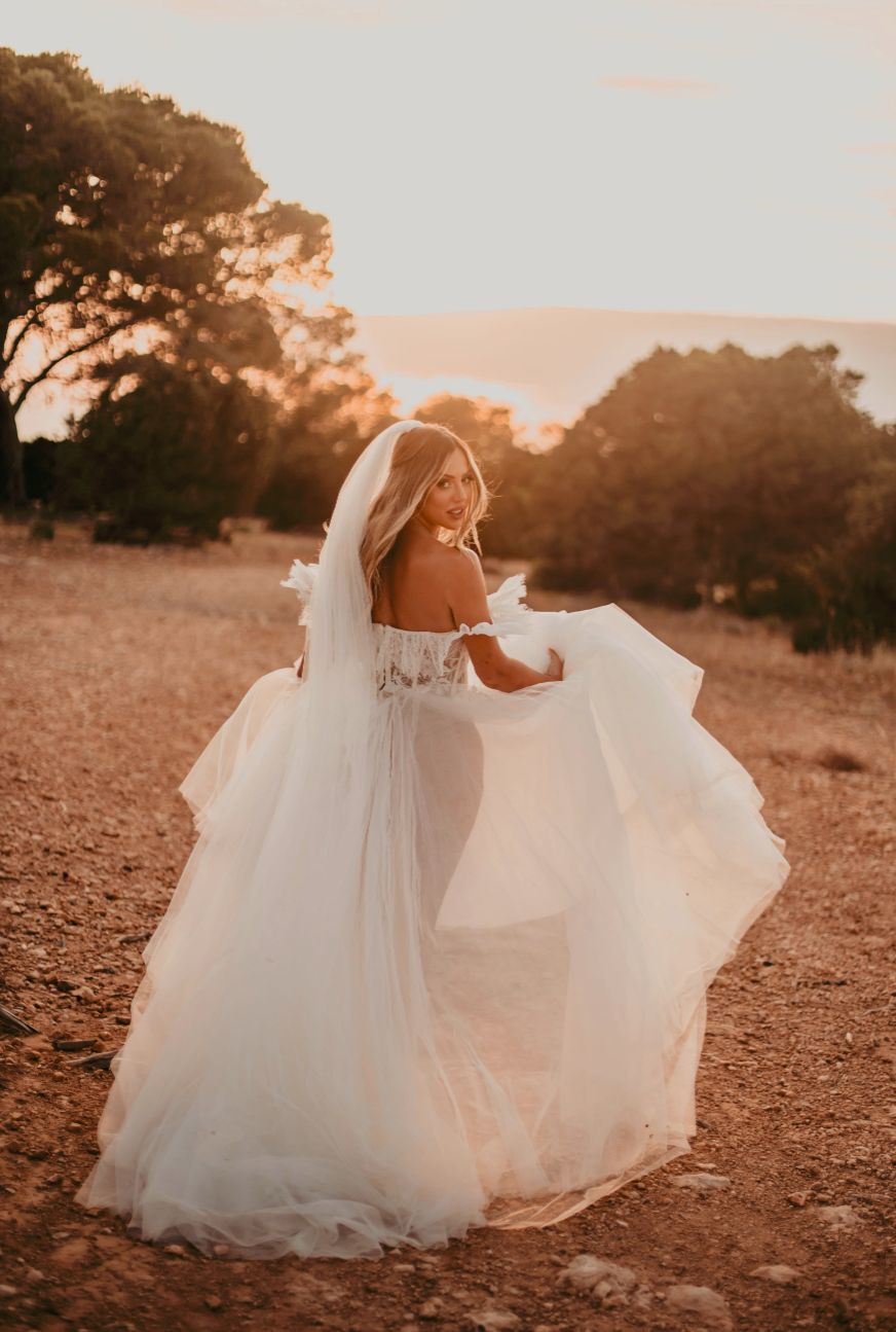 Holly Hagan in her wedding dress during an outdoor sunset photoshoot