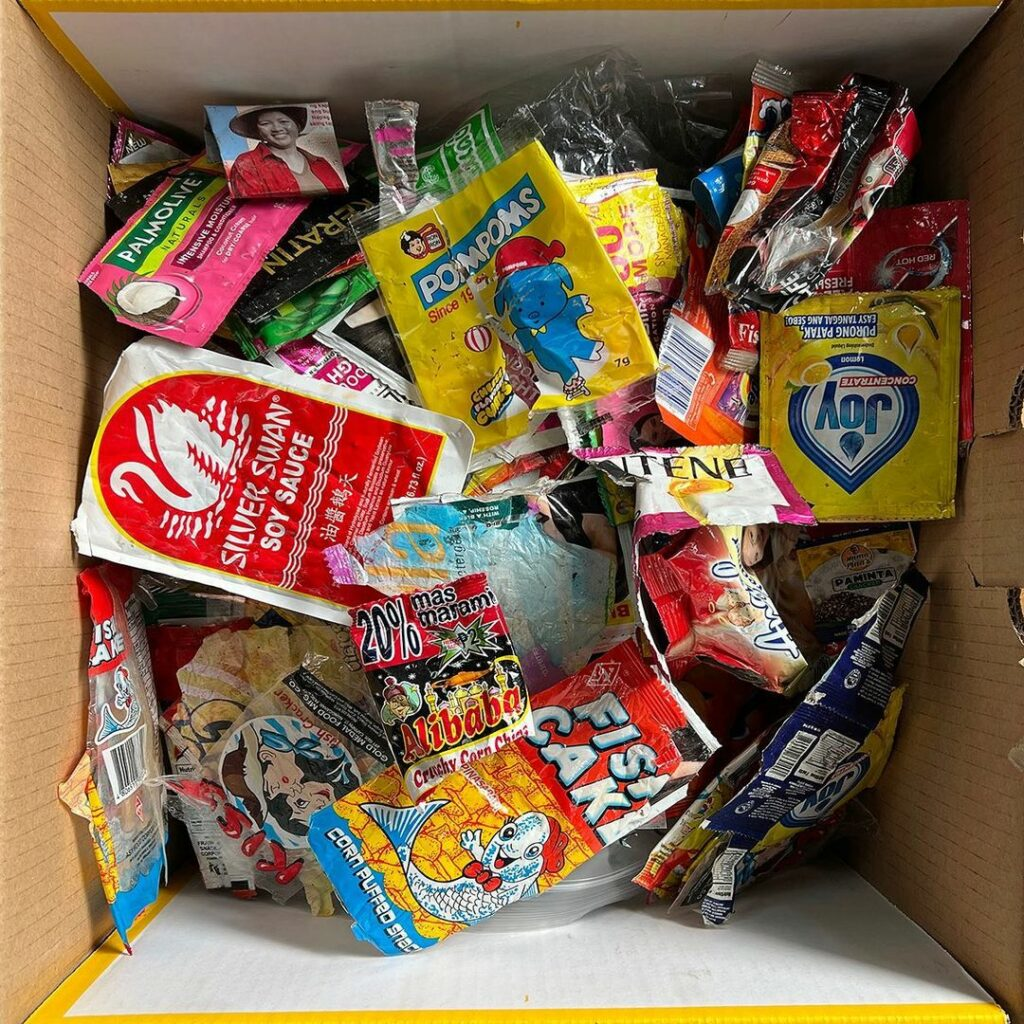 Collection of plastic sachets showing various brands and products