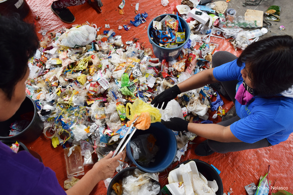 People sorting plastic waste
