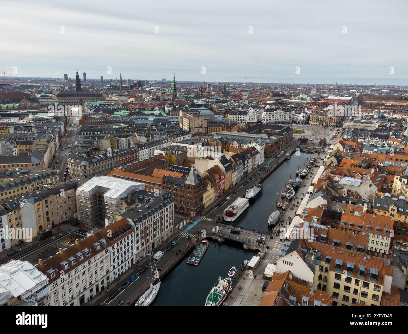 Aerial view of Copenhagen's colorful Nyhavn waterfront with boats and historic buildings