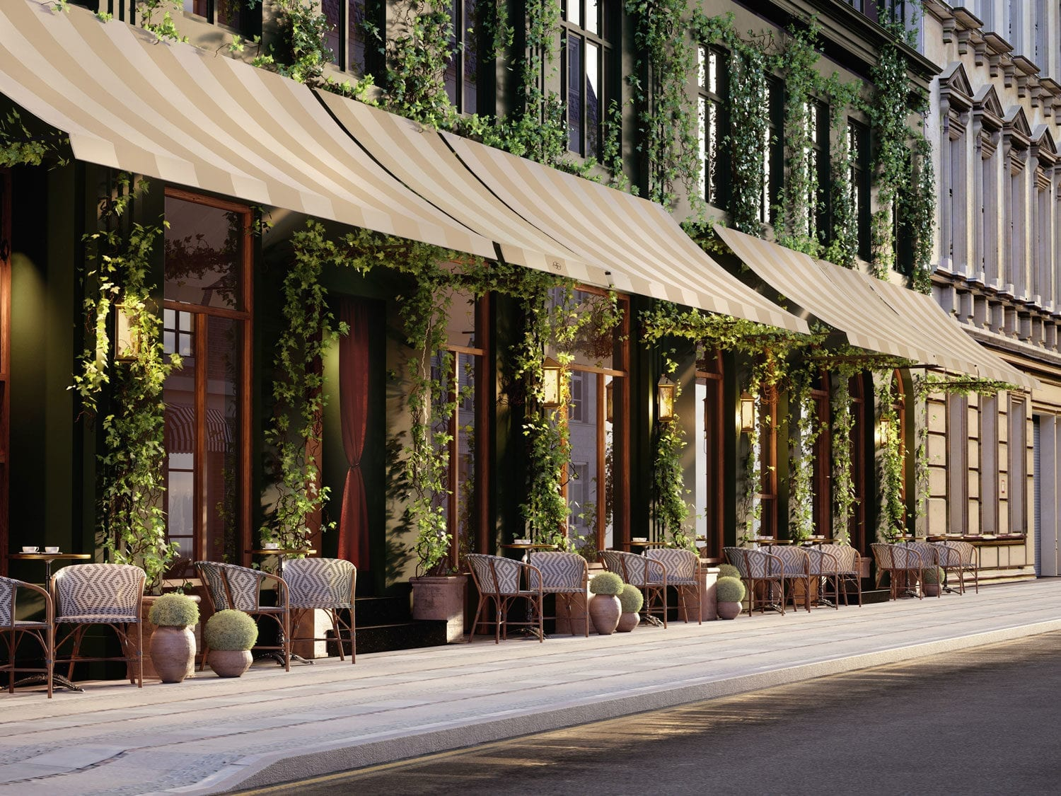 Outdoor seating at the elegant Sanders Boutique Hotel in Copenhagen with lush greenery and inviting ambiance