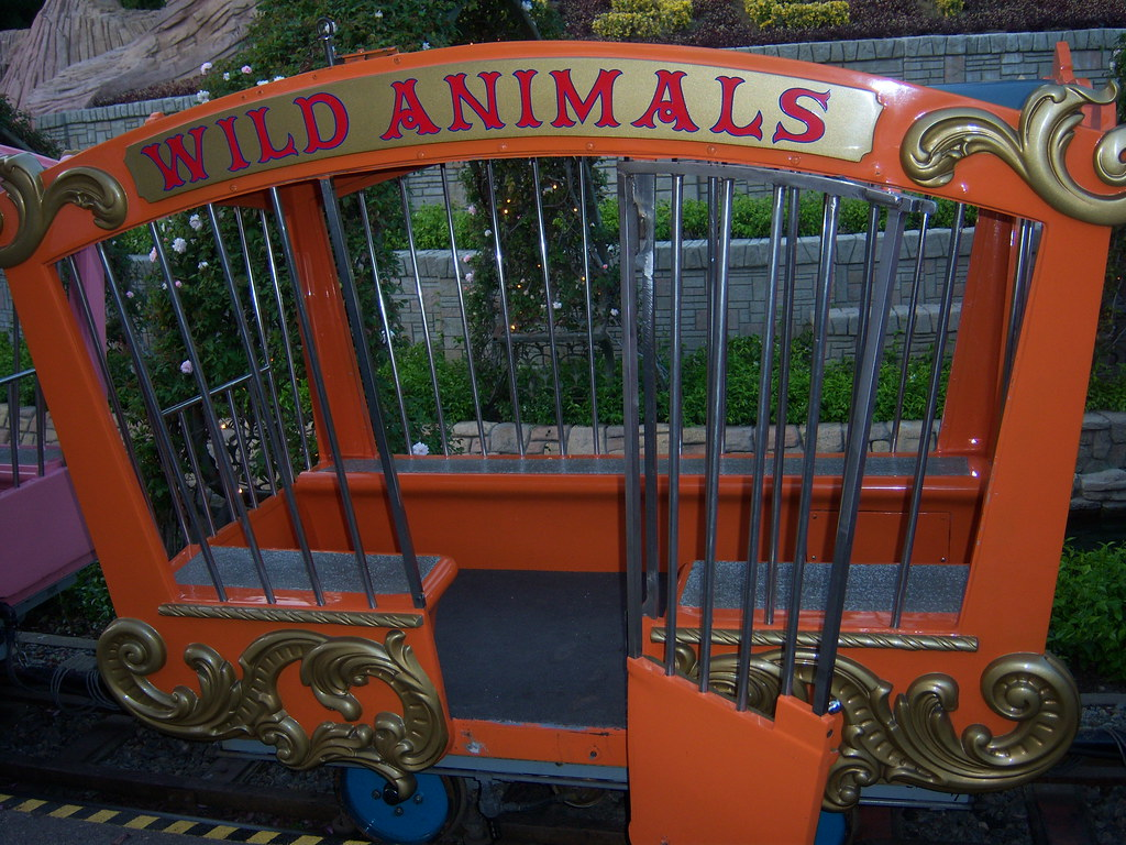 Colorful wild animal cage car of the Casey Jr. Circus Train ride at Disneyland Park.