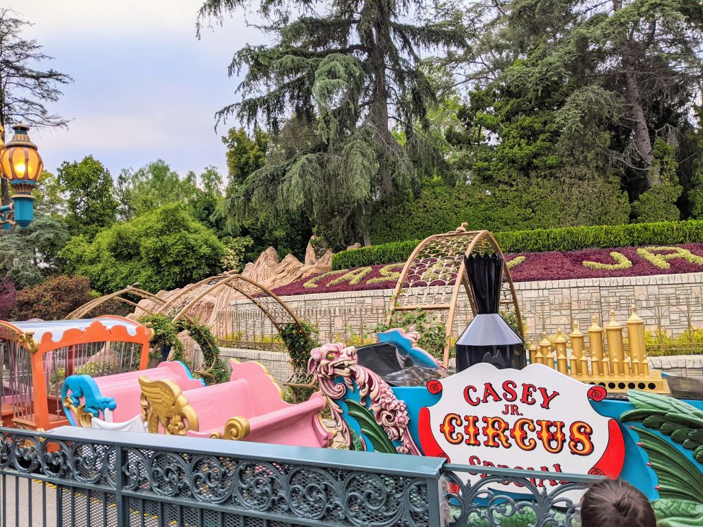 Casey Jr. Circus Train attraction featuring colorful, whimsical circus-themed carriages at Disneyland Fantasyland.