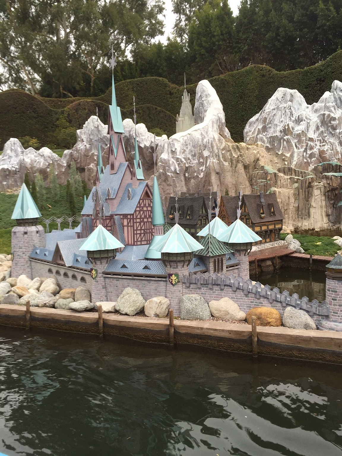 Miniature castle and mountain model in Storybook Land Canal Boats at Disneyland Park, Anaheim.