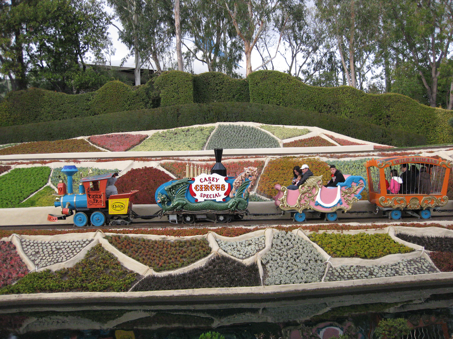 Casey Jr. Circus Train at Disneyland Fantasyland with decorative cars and scenic flower beds