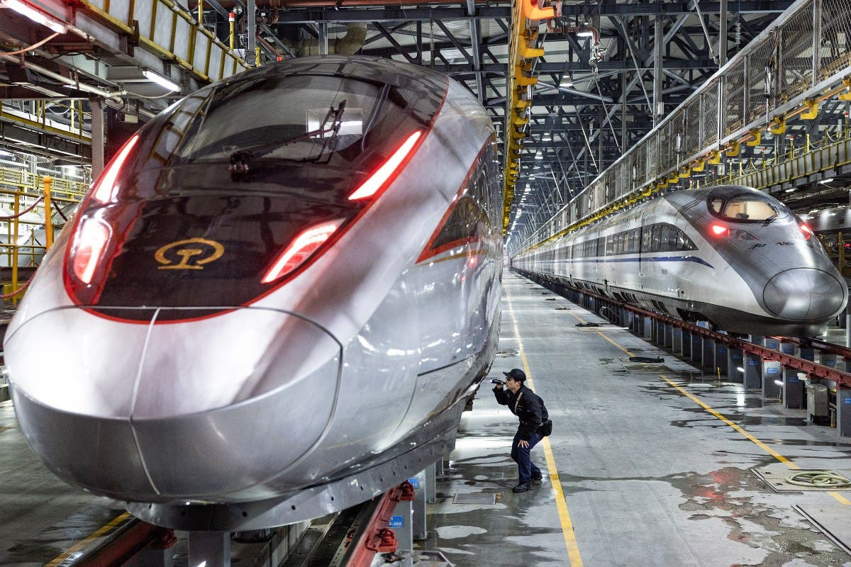 Modern Chinese high-speed trains in a maintenance facility highlighting advanced rail technology