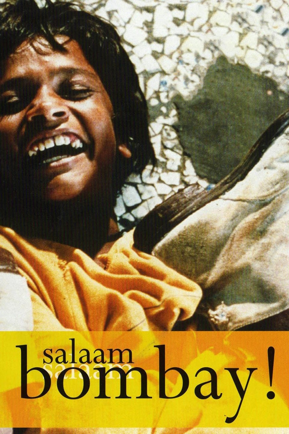 A joyful boy from the movie poster of Salaam Bombay! illustrating street children life in Mumbai