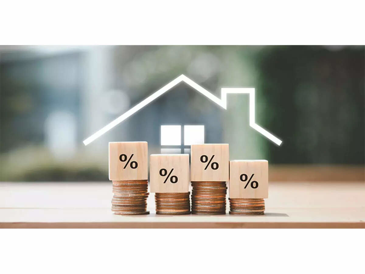 Mortgage rates visualization showing percentage symbols stacked on coins with house outline