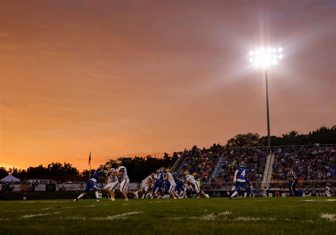 High school football game under night lights